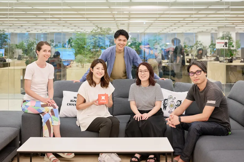 People posing on a sofa