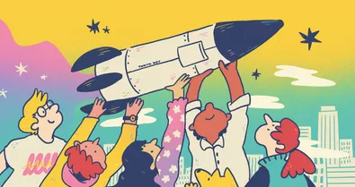 People holding a rocket ship over their head.