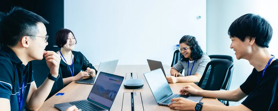 Four people having a meeting