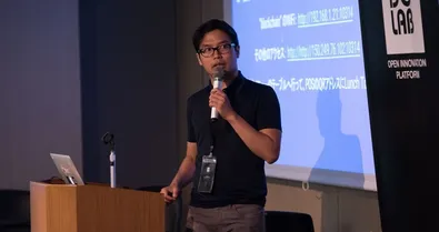 Anditto presenting at an event.